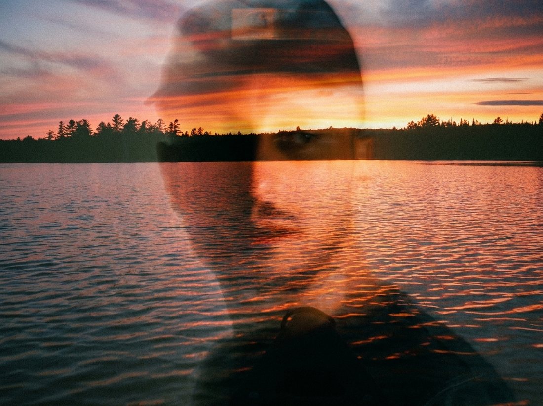 Uness editorial portrait, lake at sunset